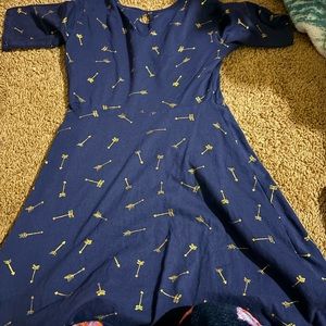 Navy blue with arrows on the dress